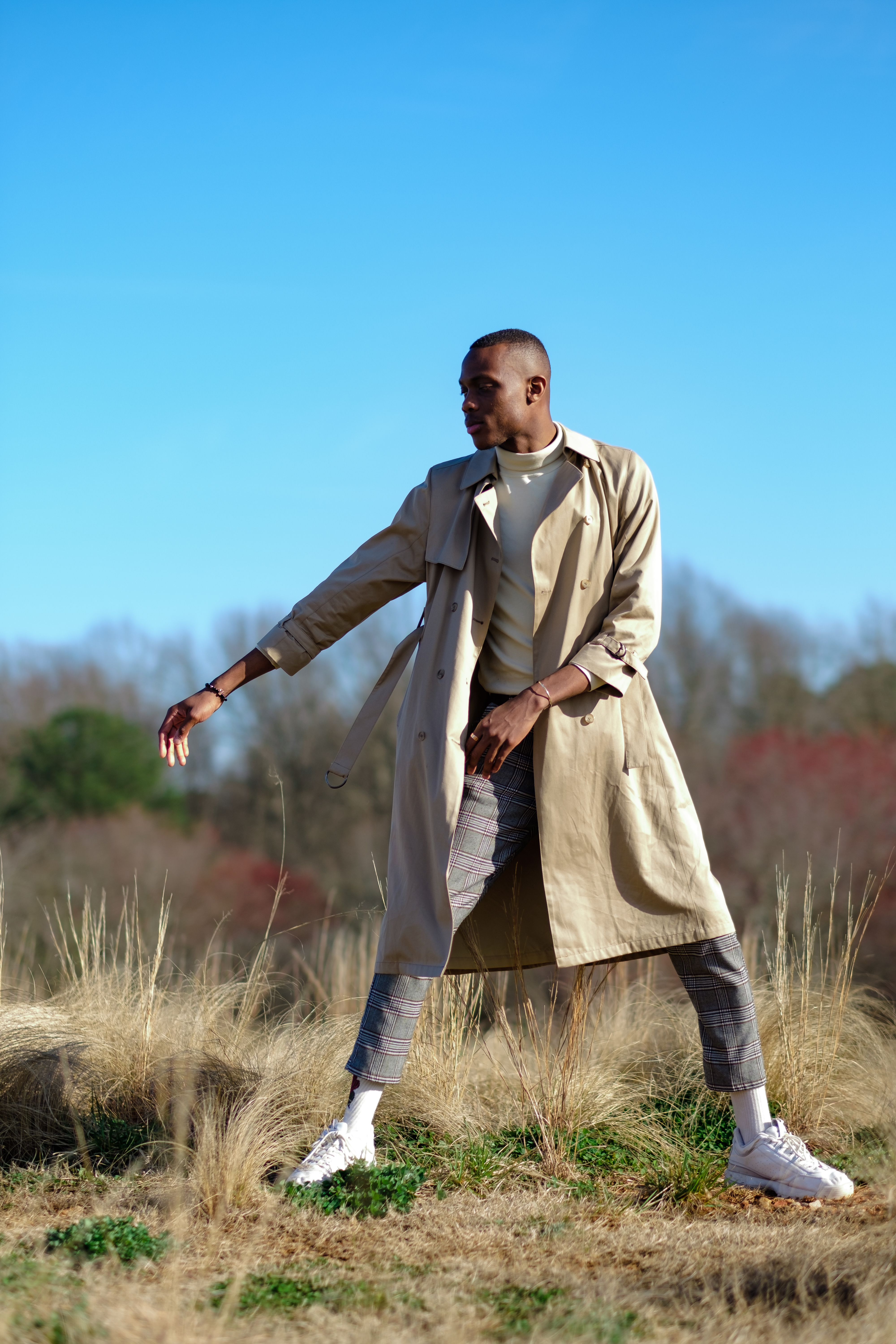 Model in bright yellow shirt seated in a fashion portrait